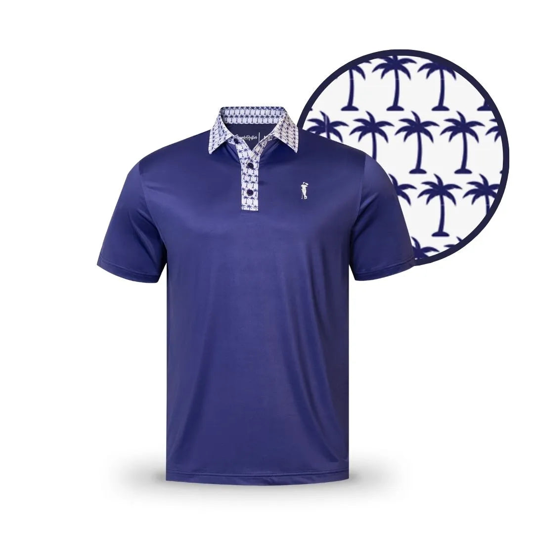 The Grunk Dolfer Navy Palm Pop polo has short sleeves and a cool tropical vibe, featuring a white and blue palm tree print on the collar and placket, a small chest logo, and an enlarged view of the palm pattern.