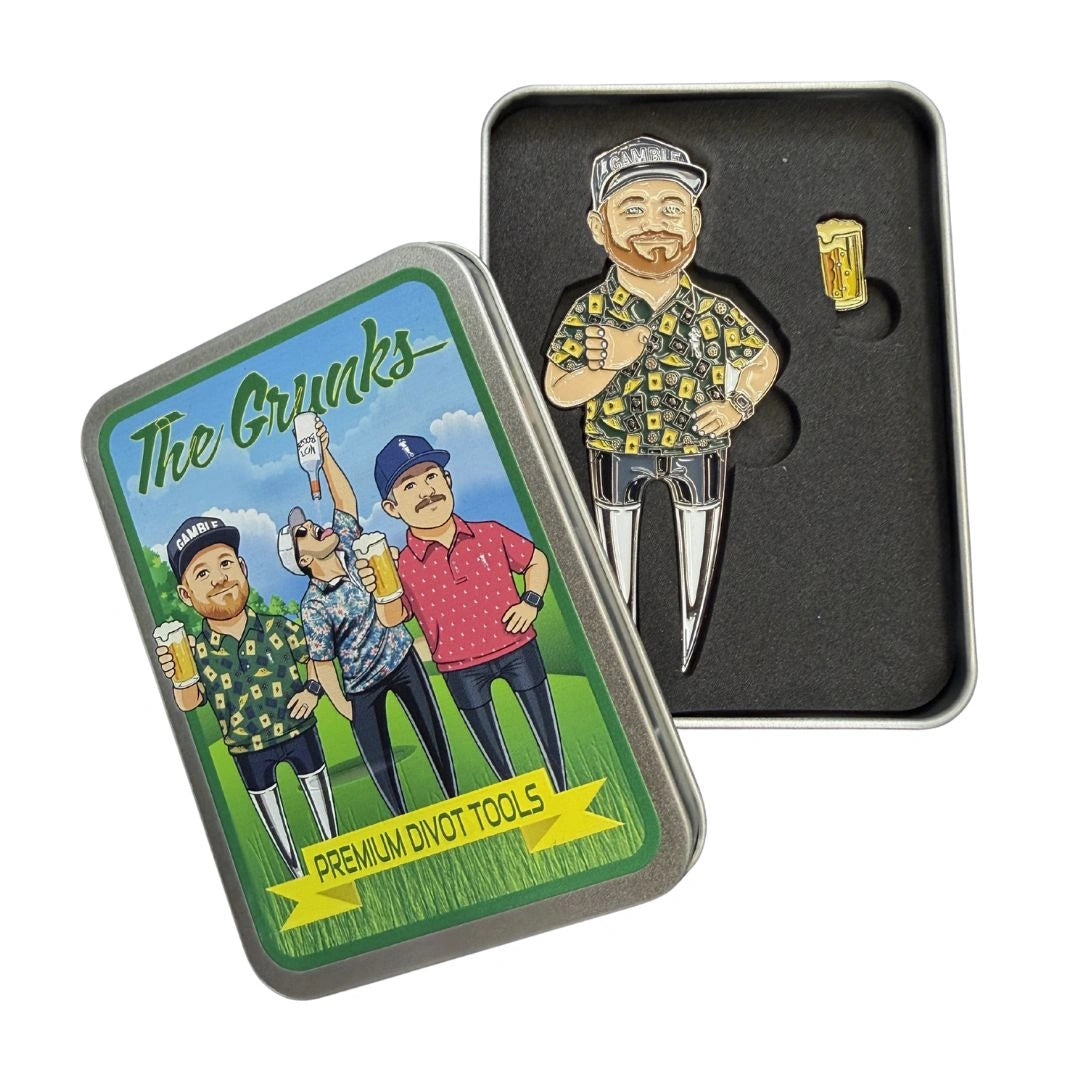 A Grunk Dolfer tin shows three men with beer. Inside, there's a Grunk Prez Divot Tool shaped like a man in a floral shirt and a magnetic ball marker that looks like a pint of beer.