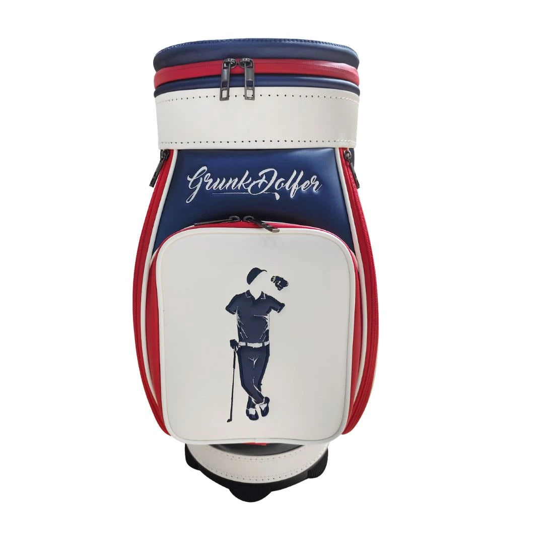 The Grunk Dolfer Grunk Fathers Den Caddy is a white and navy patriotic golf accessory with red accents, featuring "Grunk Dolfer" text and an illustration of a golfer tipping their cap.