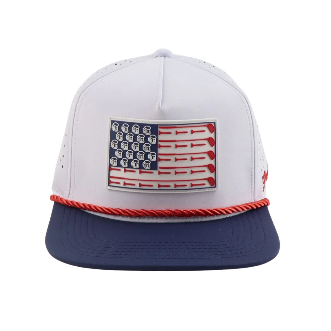 The Grunk Dolfer Grunk Flag Hat features a white and navy colorway, red rope detail, and front patch with beer mugs as stars and red stripes—delivering a fun American flag vibe, perfect for your next golf round.