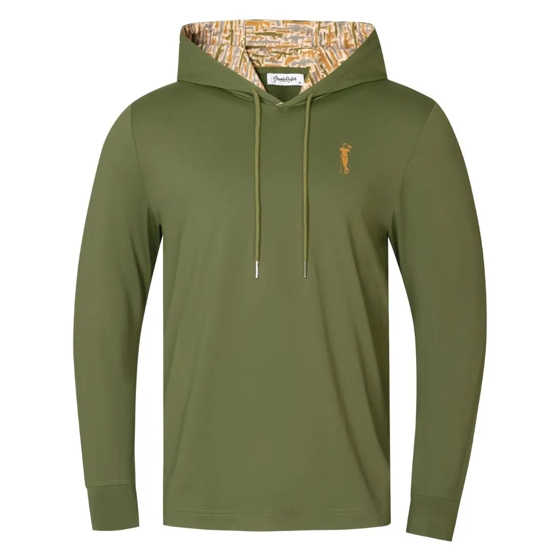 The Grunk Dolfer Desert Gamo Hoodie is an olive green, long-sleeve hoodie with a patterned inner hood, drawstrings, and a small gold embroidered figure on the left chest.