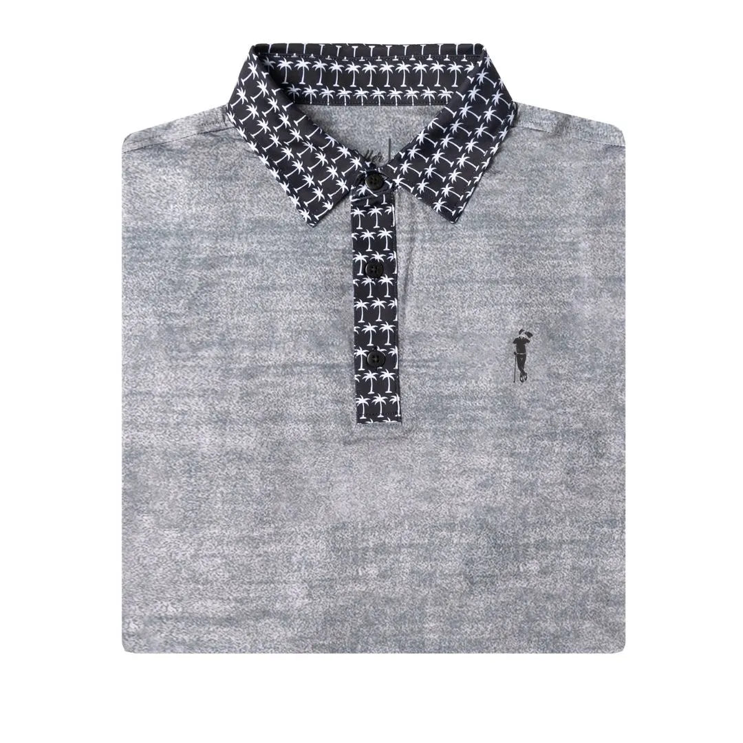 The Grunk Dolfer Grey Palm Pop is a folded gray polo with a black and white palm tree-patterned collar and button placket, finished with a small embroidered golfer logo on the left chest for subtle style and a touch of flair.