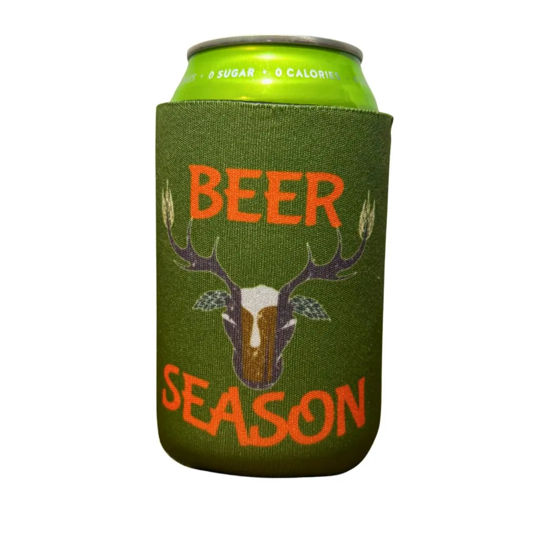 The Grunk Dolfer Beer Season Koozie features green camo, a deer skull with antlers, and orange "BEER SEASON" text to keep your drink cold.