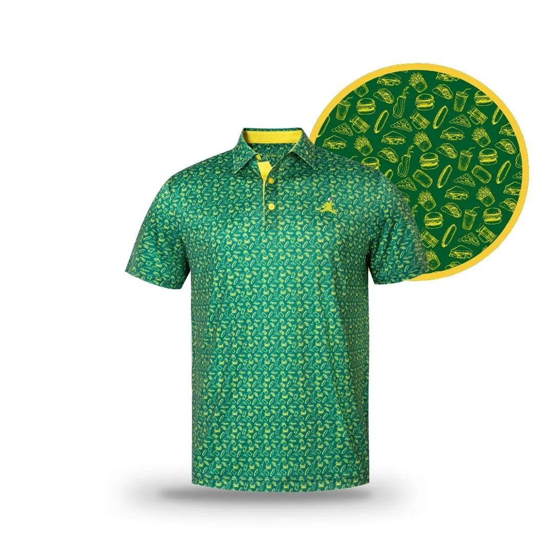 The Grunk Dolfer Green ChunkMan Polo features a yellow collar and buttons with a fun hot dog, burger, and fries pattern. A circular close-up shows the playful food-themed golf design—just right for your next spring tournament.