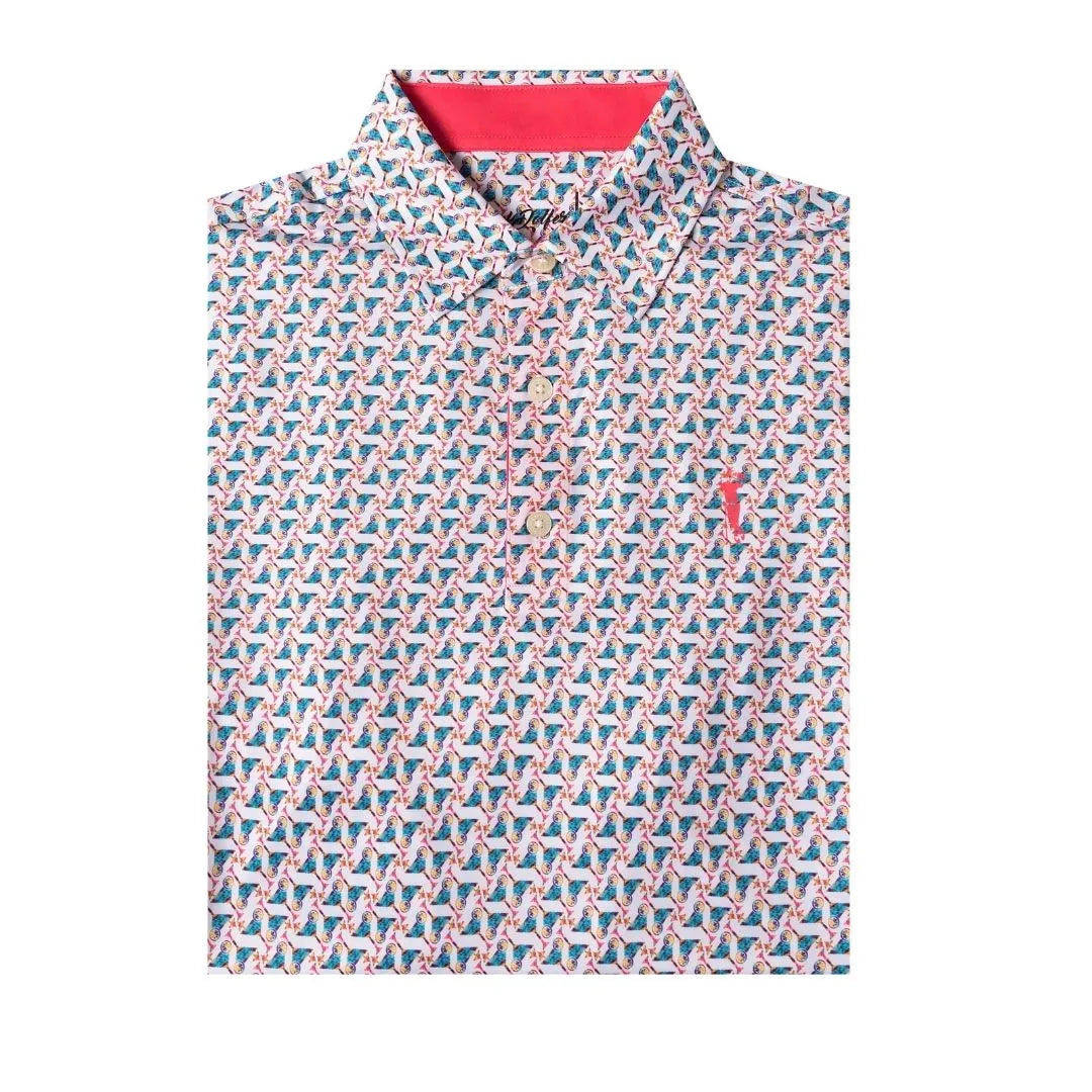 The Grunk Dolfer Mosaic Cocktail is a collared short-sleeve golf polo shirt with a vibrant geometric pattern in pink, blue, and white, a bright coral inner collar, and three front buttons.