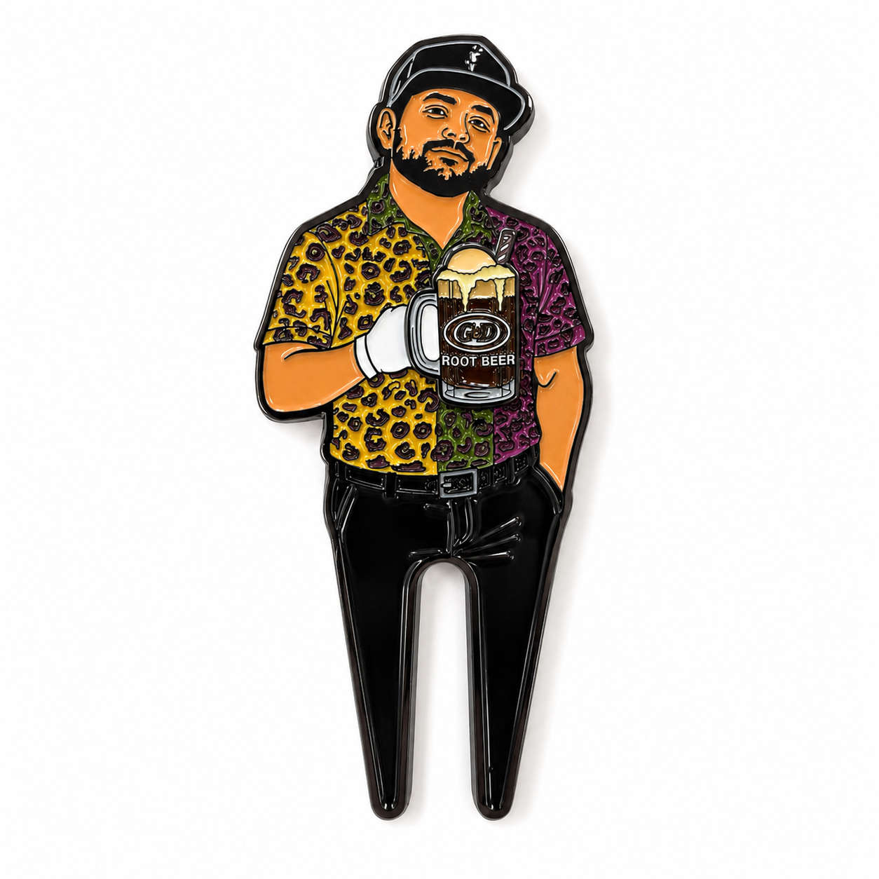 A pin depicting a bearded man in a black cap, leopard print shirt, and black pants strikes a relaxed pose with one hand in his pocket and the other holding a root beer float mug topped with ice cream—ready for the fairway with his Grunk Dolfer The Mod Goat Divot Tool, featuring a magnetic ball marker, at hand.