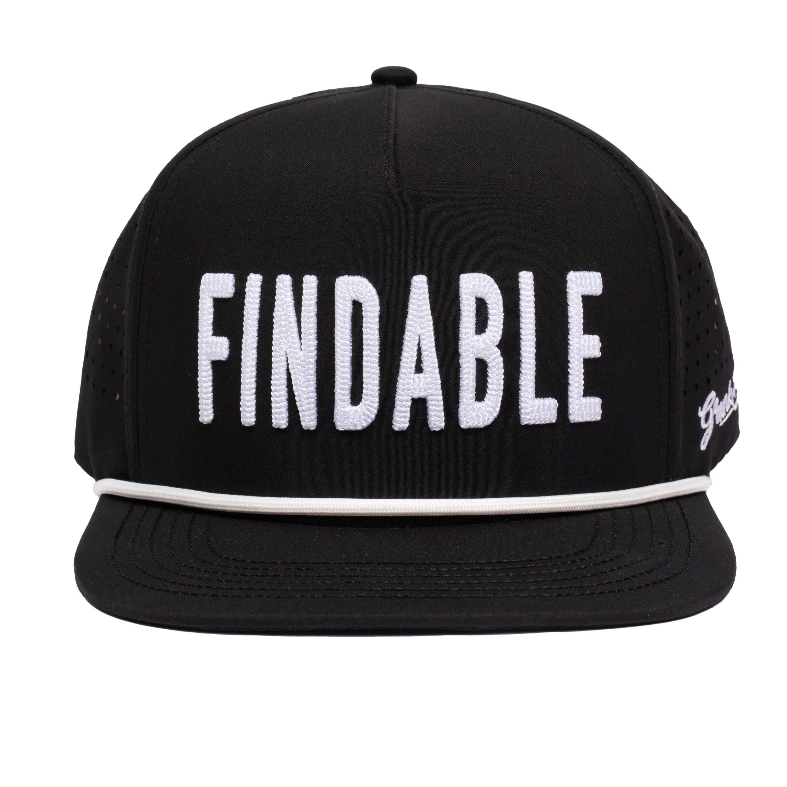 The Grunk Dolfer Findable Hat is a black snapback golf hat with FINDABLE in bold white letters, a white stripe on the brim, side ventilation holes, and a built-in magnet for your ball marker.