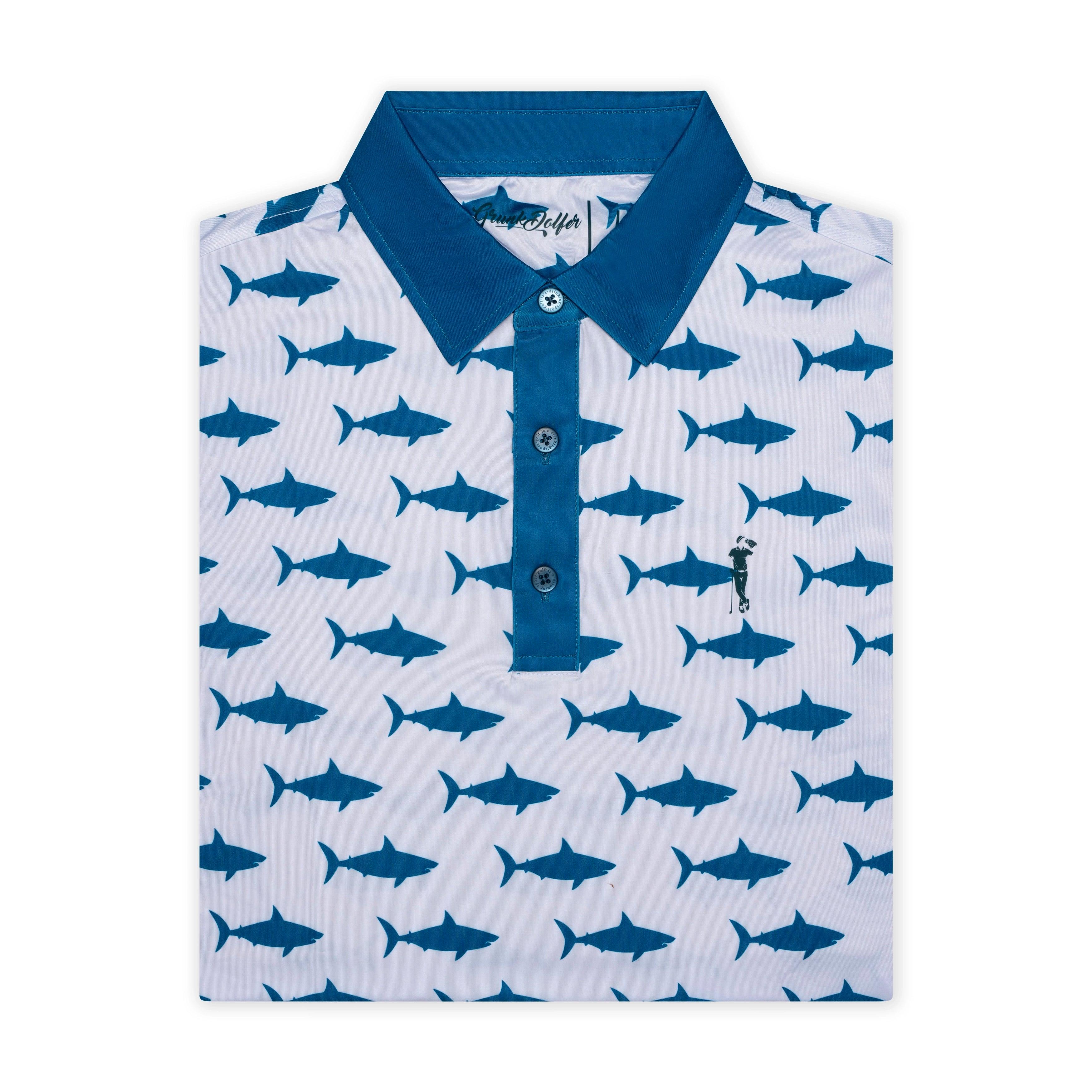 The Grunk Dolfer Water Hazard polo is a white novelty shirt with a blue collar and button placket, decorated with an all-over blue shark pattern and an embroidered man with a fishing pole on the chest—a perfect jaws-themed pick for shark fans.
