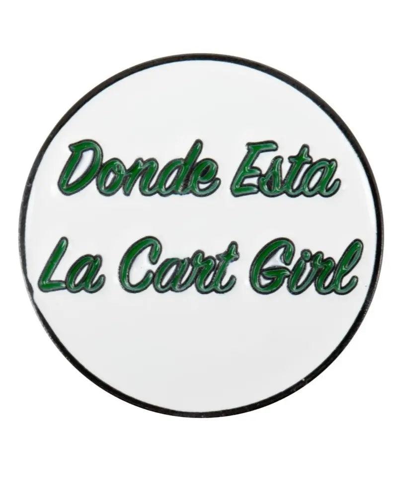 The Grunk Dolfer Donde Esta Ball Marker is a round white marker with green text outlined in black reading Donde Esta La Cart Girl. It adds fun to your golf gear and conveniently attaches to a magnetic hat clip.