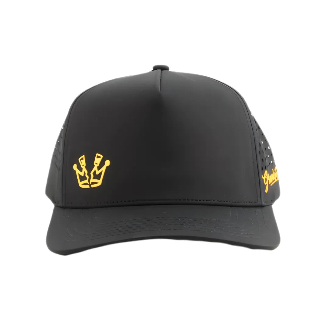 The Grunk Dolfer Shotty Hat is a black streetwear cap with a yellow crown logo on the front left and yellow script on the side. It features a structured front panel and perforated sides for added style and comfort.