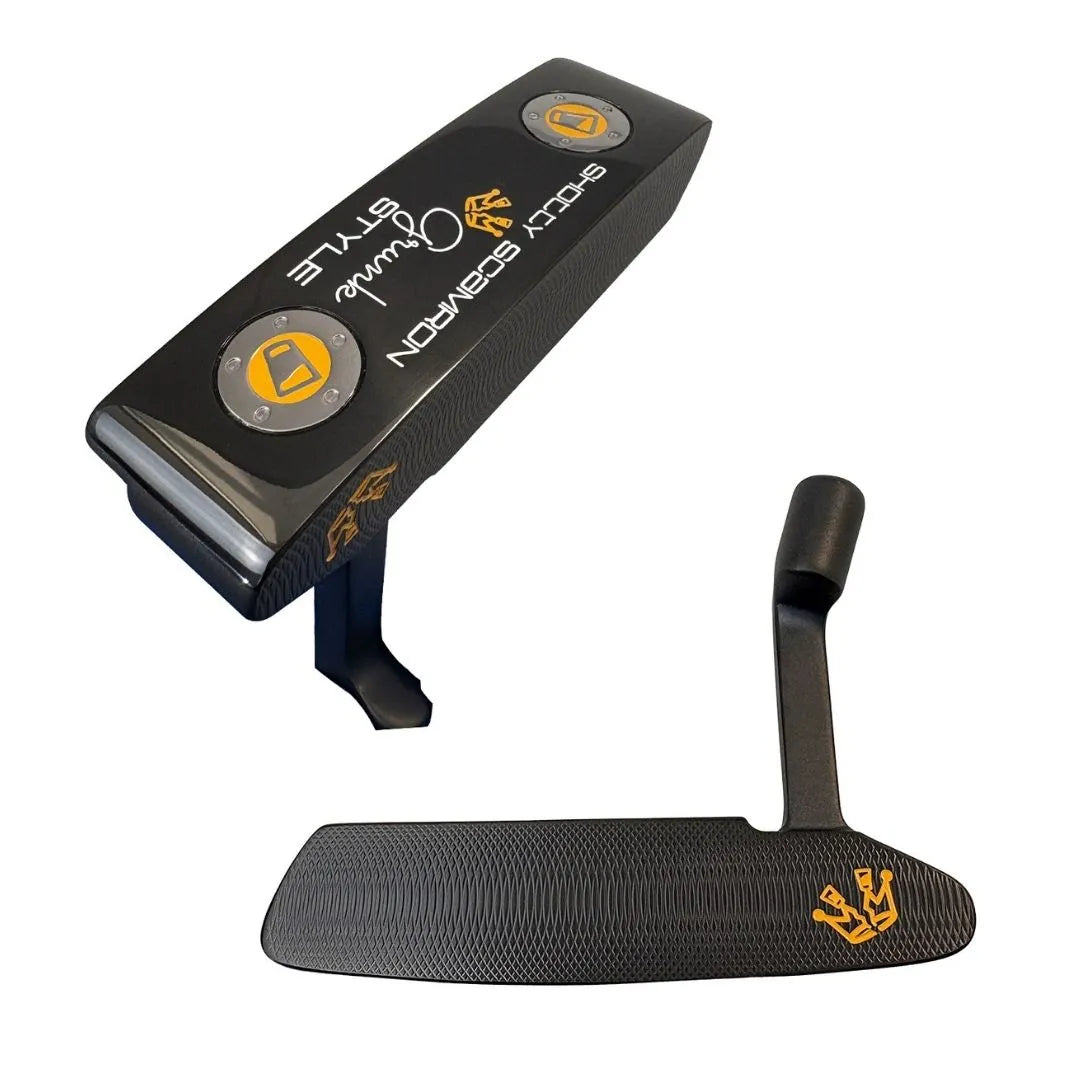 A close-up of the Shotty Putter by Grunk Dolfer shows gold logos, "Shotty Putter" text, a textured face, and a distinctive angular neck design on this precision-milled golf club.