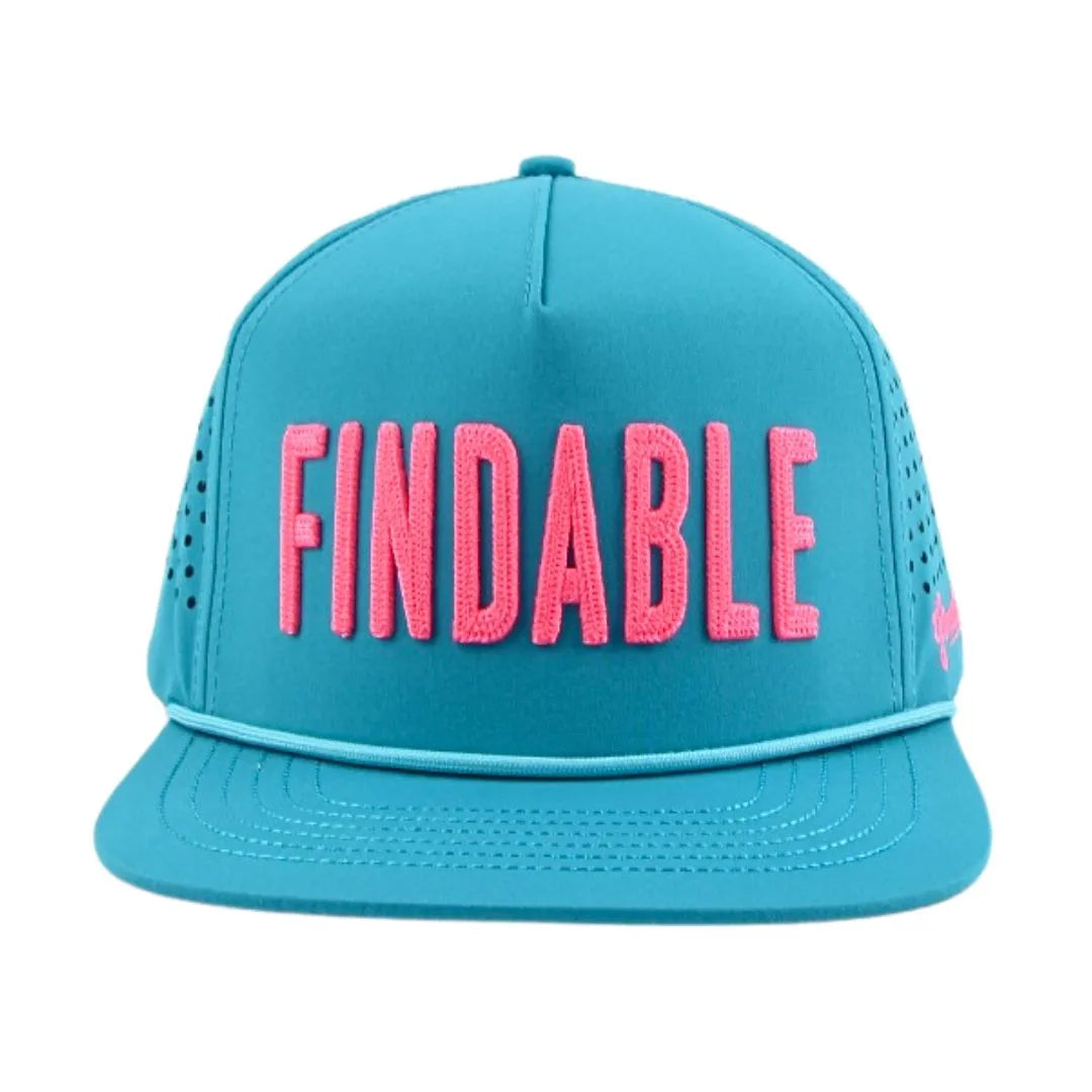 The Grunk Dolfer Blue Findable Hat features bold pink FINDABLE lettering, a magnetic flat brim, side ventilation holes, and is ideal for casual or sporty outfits.