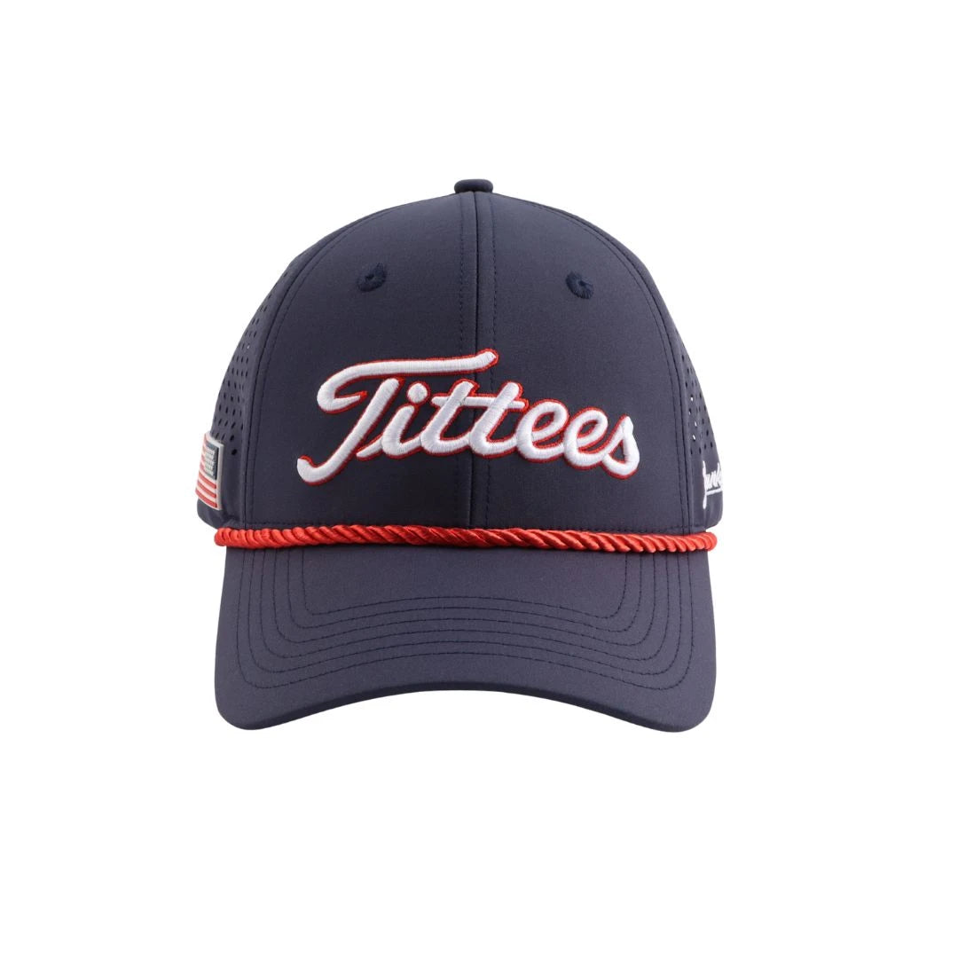 The Grunk Dolfer Navy Tittees Hat features red and white trim, "Tittees" embroidered in white script, a red rope above the brim, and a small American flag patch on the side.