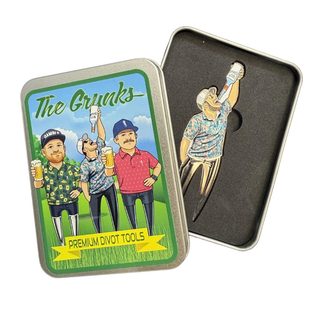A metal tin labeled Grunk Dolfer Not Booze Divot Tool showcases premium golf gear with an image of three men holding drinks on a course. Inside, the sturdy metal tool features a cartoon golfer raising a bottle overhead.