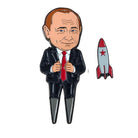 A cartoon-style figure in a suit and red tie stands next to a small cartoon rocket with a red star, all set against a white background—making this the perfect design for the Grunk Dolfer Putin Divot Tool or anyone seeking a unique golf ball marker.