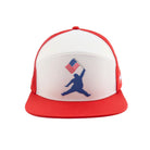 The Grunk Dolfer Patriot Chunkman Hat is a red and white performance golf snapback with a blue silhouette of a person jumping and holding an American flag on the front, combining style with patriotic flair.