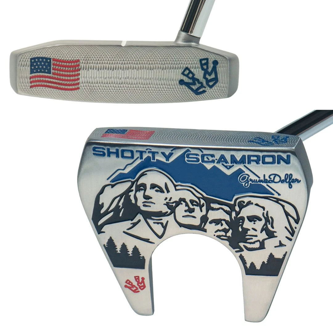 The Grunk Dolfer Grunk Fathers Shotty Putter is a silver, precision milled club featuring Mount Rushmore, pine trees, and the American flag, with “SHOTTY SCAMRON” and Grumble Golfer on the back plus anchor and flag face designs.