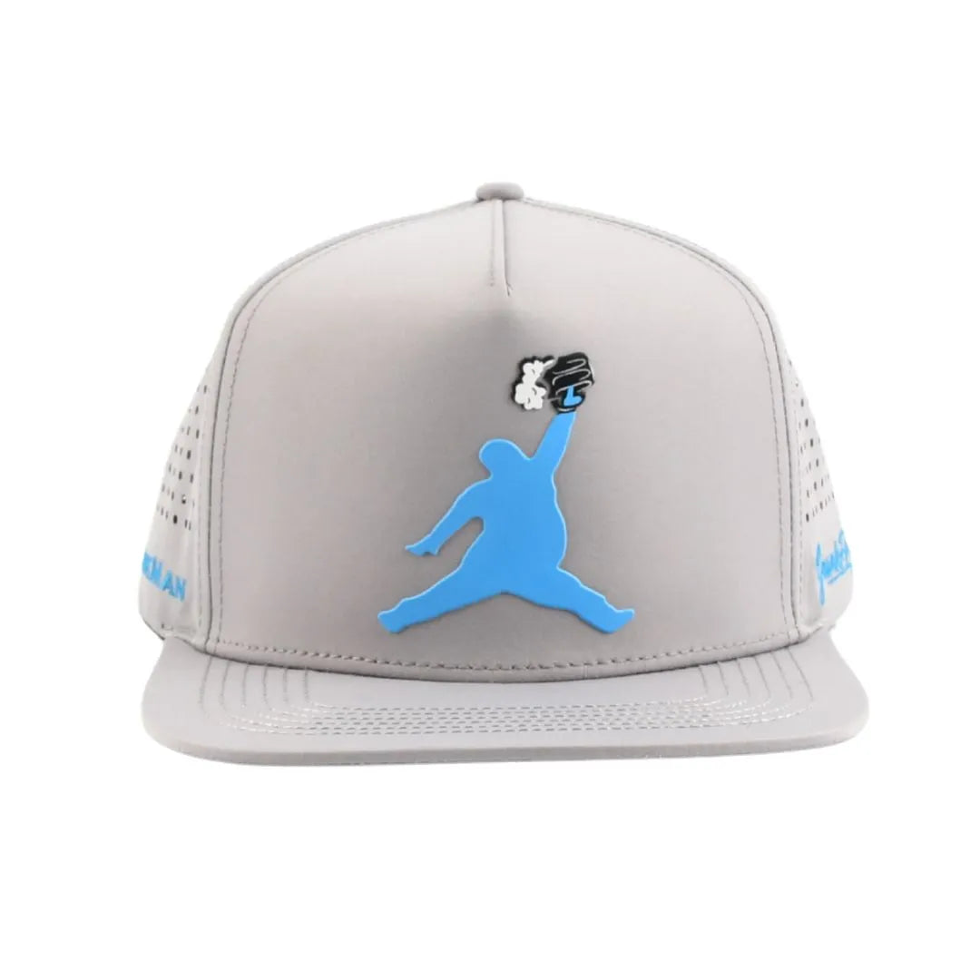 The Grunk Dolfer ChunkMan Hat is a gray, moisture-wicking cap with perforated side panels, a blue silhouette of a person jumping with a black and white baseball glove on the front, and blue text on the sides.