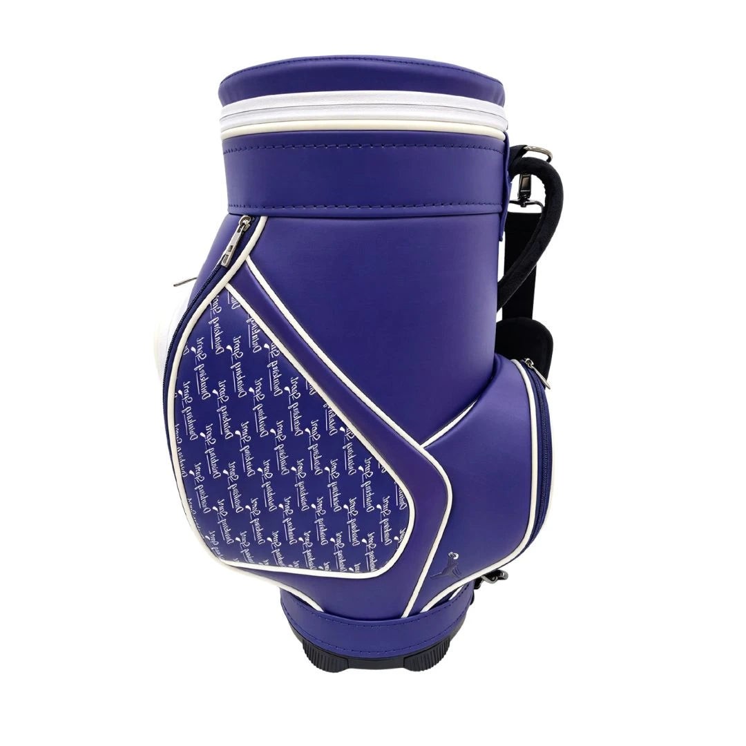 A purple Grunk Dolfer Blue Drinking Sport Den Caddy featuring a white pocket with a repeating navy blue logo pattern and a black shoulder strap.