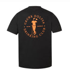 The Orange Member Tee by Grunk Dolfer is a black golf shirt featuring an orange graphic on the back of a person holding a golf club and drink, with text: “Grunk Dolfer Drinking Club Member Tee, Est. 2021, San Diego CA.”.