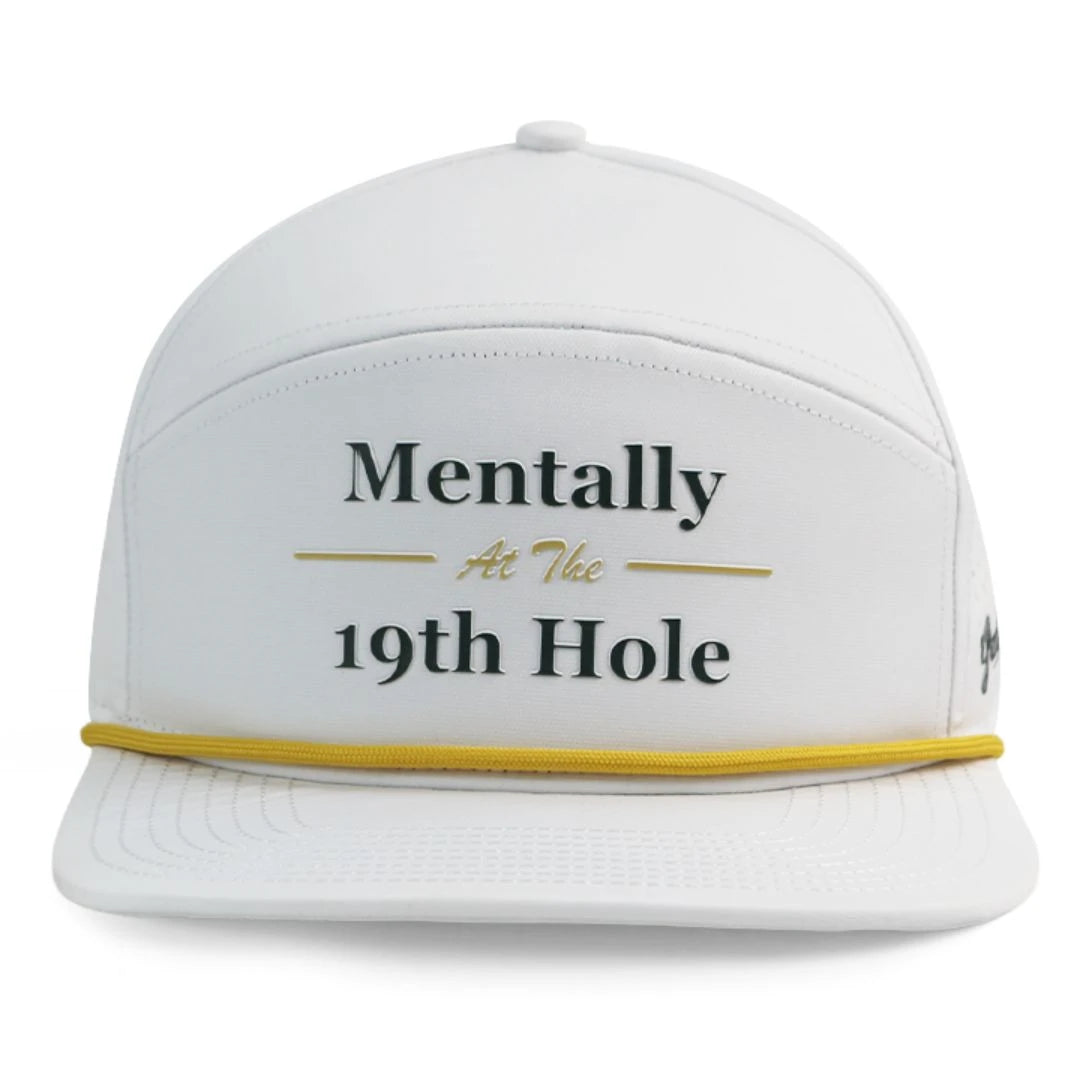 The Mentally 19th Hat by Grunk Dolfer is a white performance golf hat with yellow trim and Mentally At The 19th Hole embroidered on the front—perfect style for on or off the course.