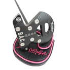 CNC-milled aluminum Grunk Dolfer BAC Putter head with metallic accents and four small icon engravings, resting on a black and pink protective headcover.