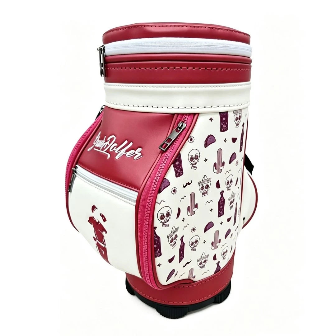 Burgundy Drinko Mini Den Caddy by Grunk Dolfer: burgundy bag with cartoon skulls, cacti, and sunglasses. Features multi zippered pockets, bold stitching, insulated cooler—Loyal Golfer in script on front.