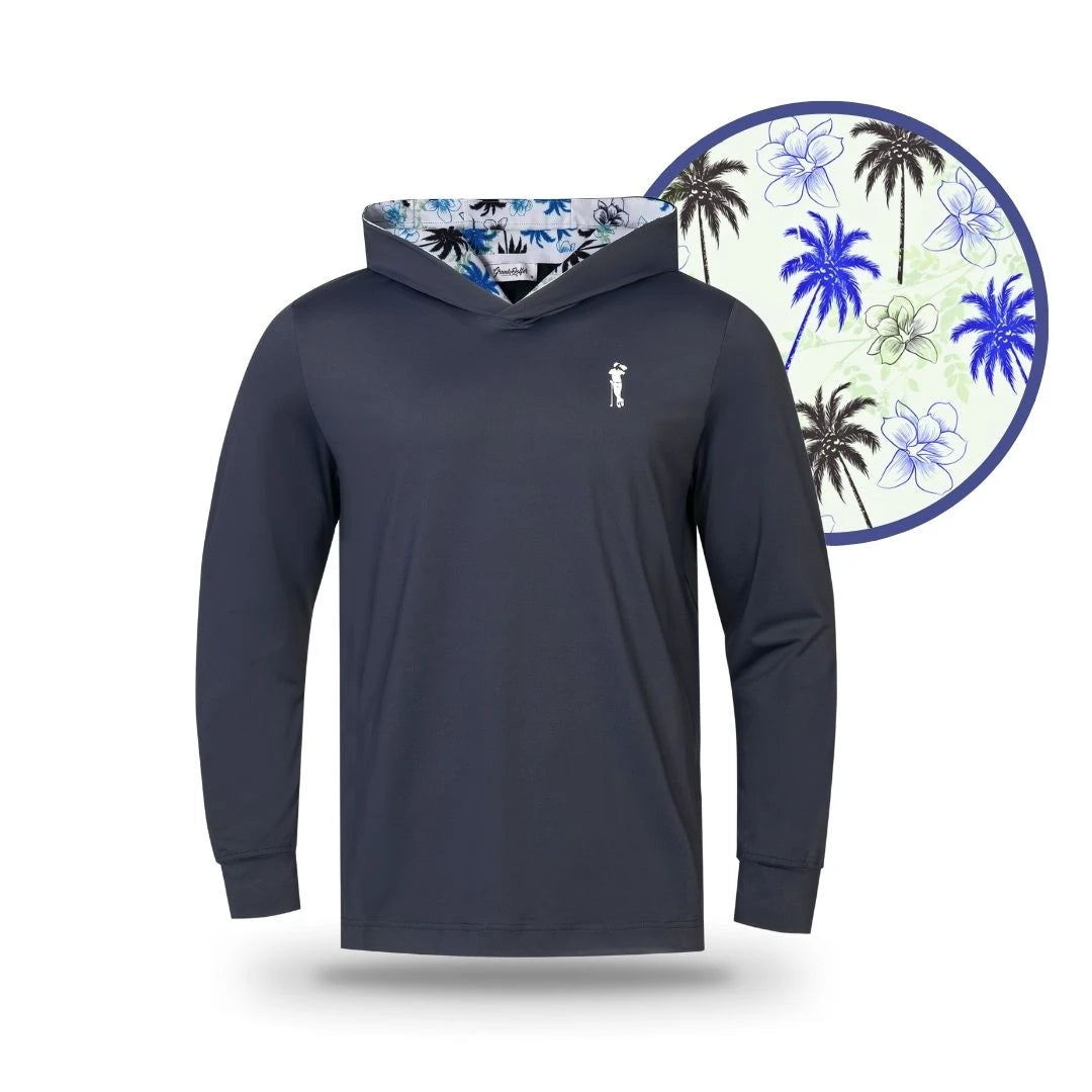 The Grunk Dolfer Fairway Palms Hoodie is a navy blue long-sleeve performance top with a tropical hood lining of blue palm trees and white flowers, made from lightweight breathable fabric and shown in a circular inset for detail.