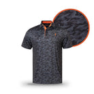 The Grunk Dolfer Member Camo polo features short sleeves, black and dark gray camo with an orange collar accent and small chest logo. A close-up shows the pattern—ideal golf wear for the Grunk Dolfer Drinking Club.