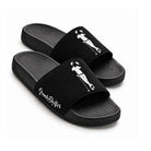 Pair of black Grunk Dolfer Black Suede slides featuring a white golfer silhouette graphic on the straps, script text on the side, and a comfortable molded footbed.