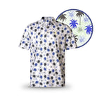 The Grunk Dolfer Fairway Palms polo features short sleeves, a white base, black and blue palm trees, and blue outlined flowers. A close-up circle highlights this unique golf shirt’s vibrant design.