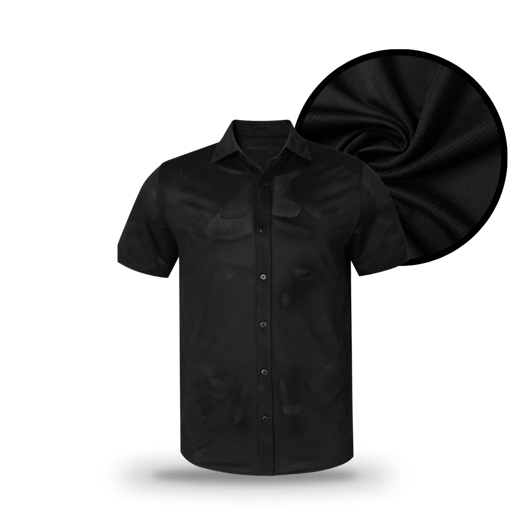 A short-sleeve Black Button Down by Grunk Dolfer with a pointed collar, shown in front of a close-up fabric swatch that highlights its smooth black texture—ideal for anyone looking for a sleek and versatile black button-up shirt.