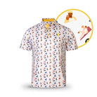 The Gilmore by Grunk Dolfer is a white short-sleeve polo golf shirt with a vibrant cartoon golfer pattern. An inset highlights a detailed illustration of a hat-wearing golfer mid-swing.