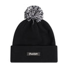 The Grunk Dolfer Bad Shots Beanie is a black acrylic hat with a turn-up cuff, topped by a black-and-white pom-pom and finished with a rectangular patch featuring white script text.