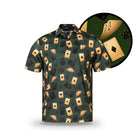 The Vegas Nights polo by Grunk Dolfer is a short-sleeved golf shirt with a green background featuring an all-over print of black and gold playing cards and dice, highlighted by a close-up of the ace of spades.