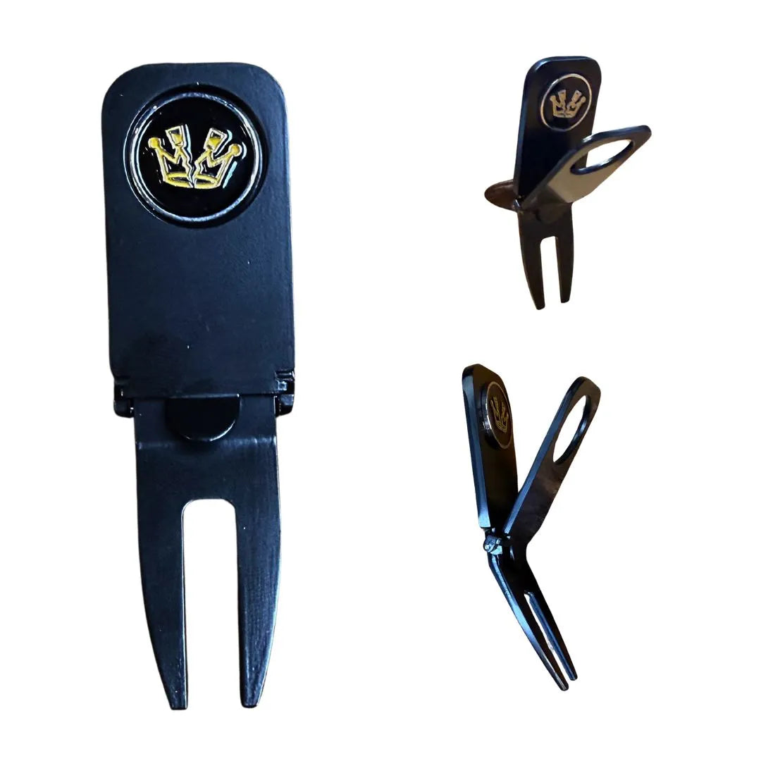 The Grunk Dolfer Shotty Divot Tool is a sleek black metal golf accessory with a gold crown emblem ball marker. Shown from front, partially open, and fully open angles, this stylish tool adds elegance to your game.