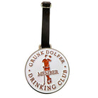 The Grunk Dolfer Drinking Club Member Bag Tag is a round, exclusive luggage tag with a belt strap featuring "DRINKING CLUB MEMBER" and an embossed red image of a person leaning on a cane and holding a drink.