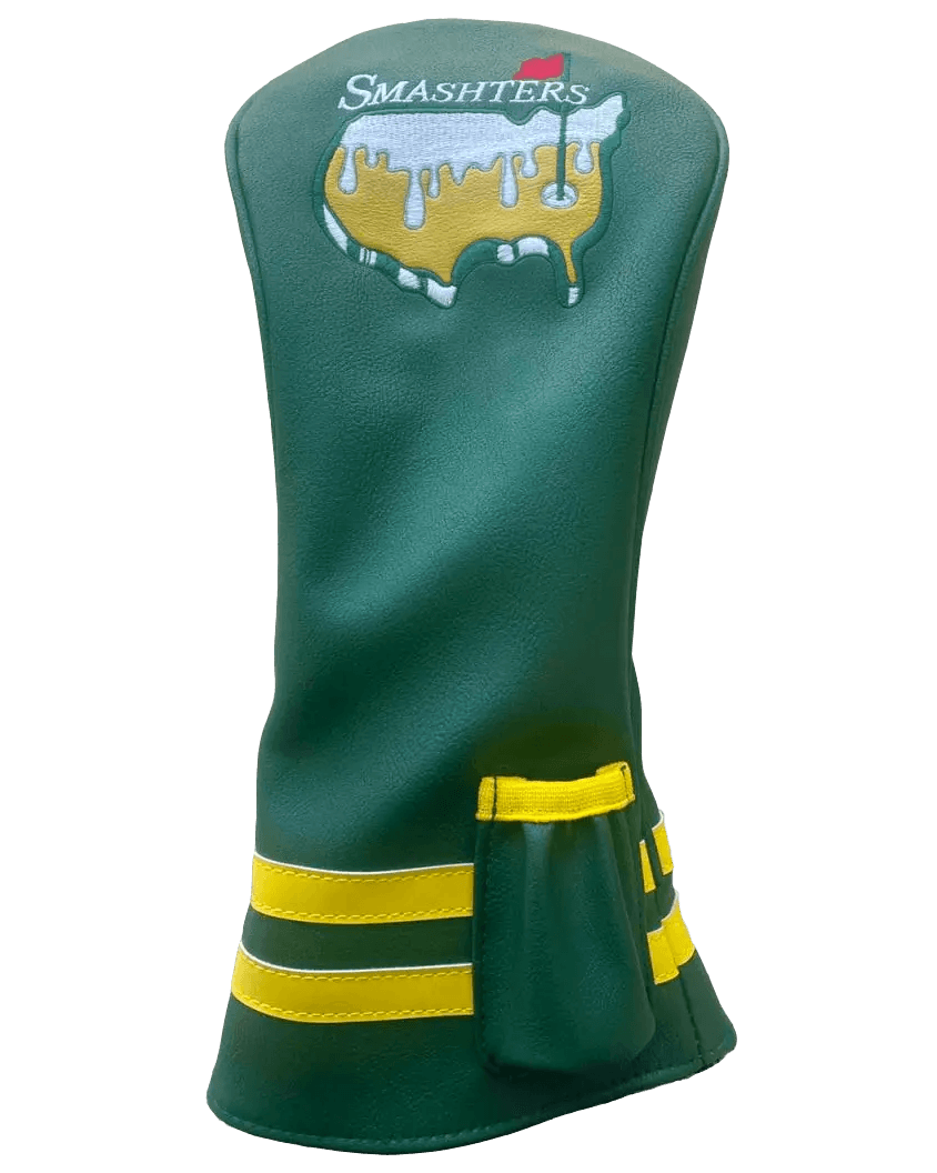 The Grunk Dolfer Smashters Driver Cover features green leather, yellow stripes, a small yellow pocket, and a SMASHTERS logo above a dripping cheese USA outline—adding standout style to your golf gear.