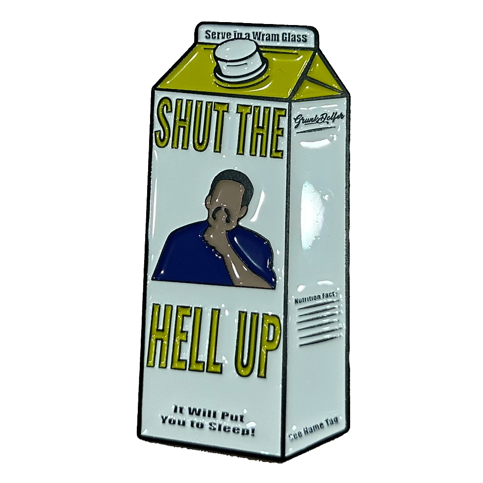The Grunk Dolfer Warm Glass Ball Marker is a milk carton-shaped pin featuring a shushing figure with SHUT THE HELL UP text, the tagline It will put you to sleep!, and nutritional facts printed on the side.