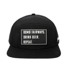 The Grunk Dolfer Golf Lessons Hat is a black snapback with a white patch reading BOMB FAIRWAYS. DRINK BEER. REPEAT.—a funny golf hat perfect for the course or after your Golf Lessons Hat sessions.